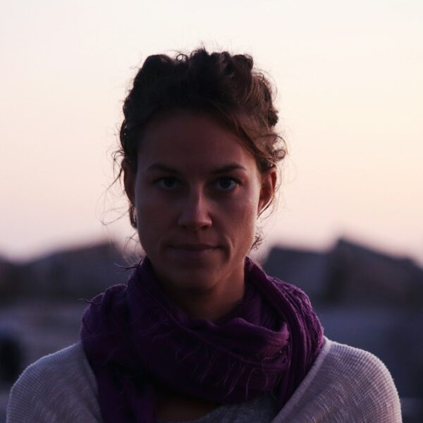 a woman with a scarf around her neck