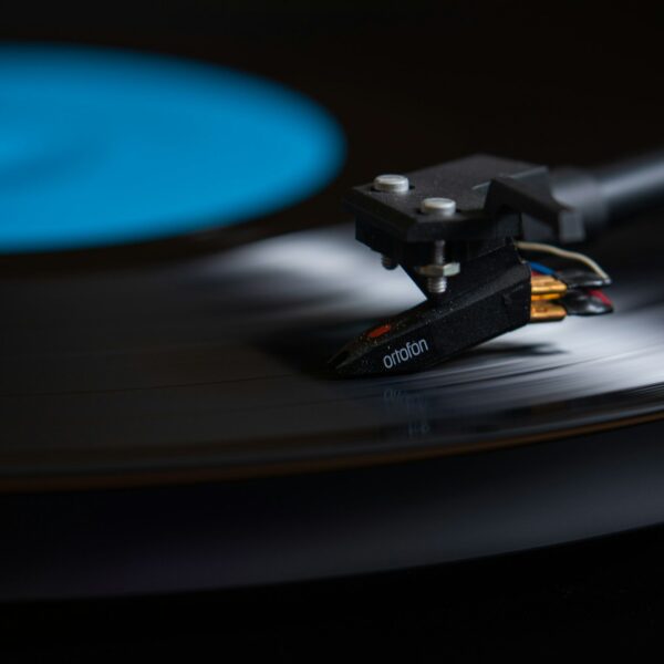 a record player with a blue disc in the background