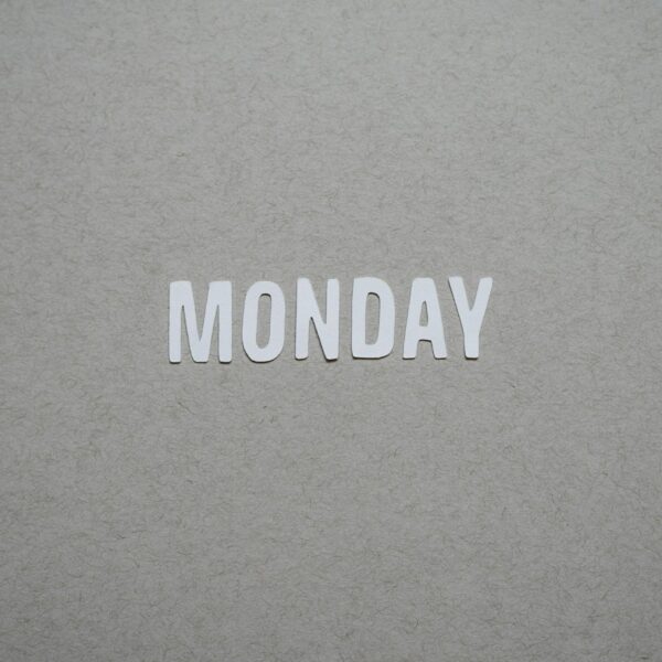 the word monday is cut out of white paper